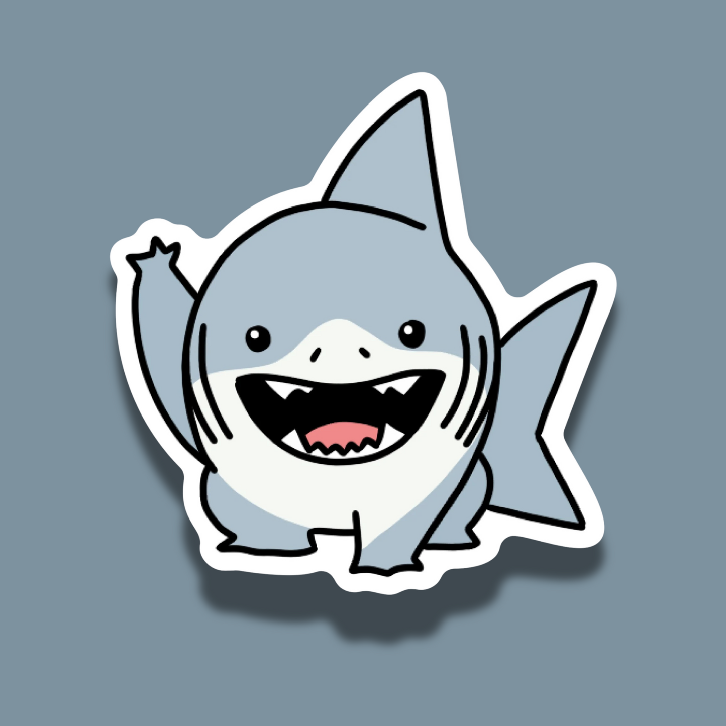 Jeff the Land Shark waving sticker on a solid grey background