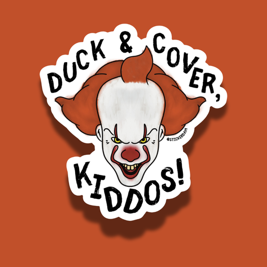 Sticker with Pennywise the clown and text 'Duck & Cover, Kiddos!' on an orange background