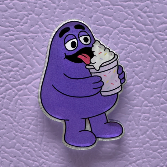 Grimace licking a purple milkshake acrylic magnet on a purple refridgerator