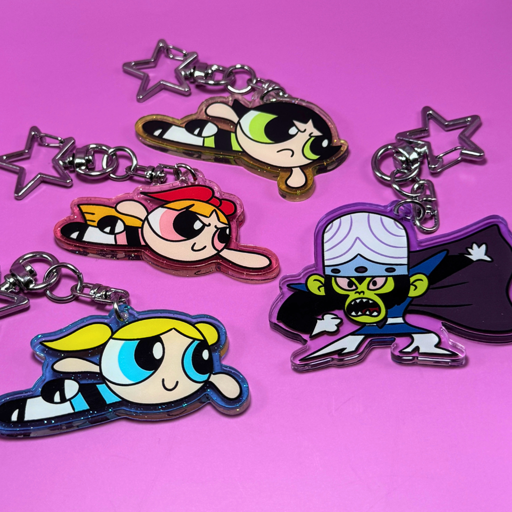 Powerpuff Girls acrylic keychains on a pink background